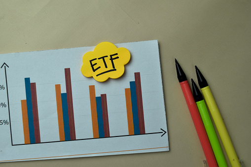 ETF - Exchange Traded Fund write on sticky notes isolated on office desk.