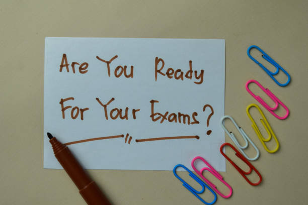 istock Are You Ready For Your Exams? write on sticky notes isolated on office desk. 1286975099