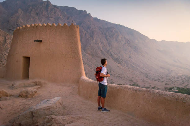 Man visiting Dhayah Fort in north Ras Al Khaima in the UAE stock photo