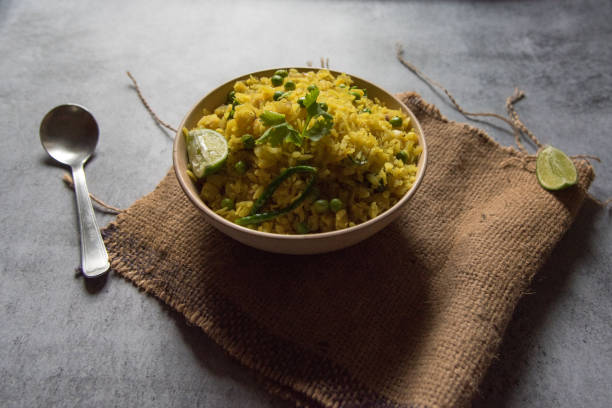 istock Popular breakfast ingredient poha or flattened rice in a bowl 1286978393