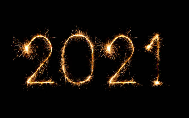 istock 2021 happy new year fireworks written sparklers at night 1286985675