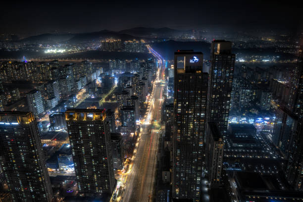 Songdo city view at night Songdo city view at night with tall apartment buildings and business complexes. Taken in Songdo, Incheon, South Korea on November 13th 2020. songdo ibd stock pictures, royalty-free photos & images
