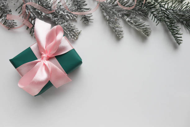 istock christmas card with gift box and christmas tree 1286985711