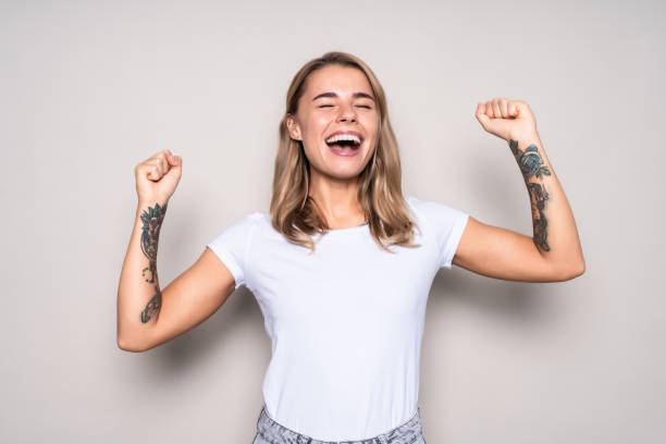 istock Successful woman looking very happy isolated over a white backgorund 1286986899