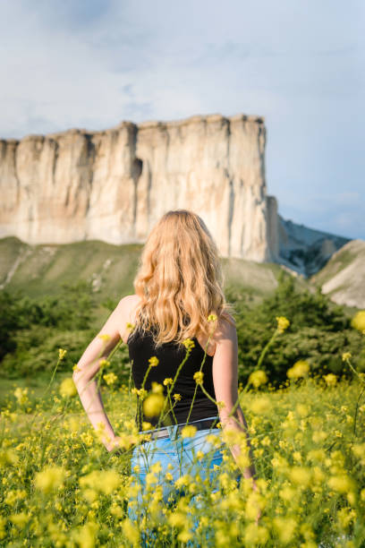Girl posing in a rapeseed field