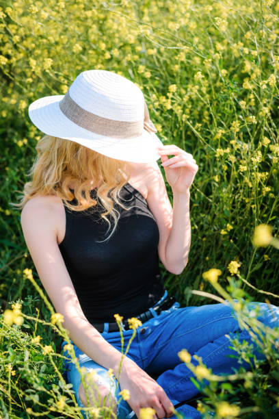 istock Girl posing in a rapeseed field 1286986948