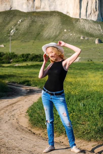 Girl posing in a rapeseed field