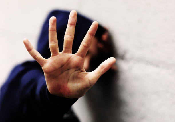 istock hand of the young girl which protects itself with a dramatic eff 1286988081