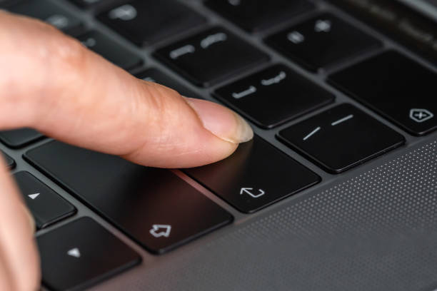 istock close-up female hand pressing enter button on laptop keyboard 1286988941
