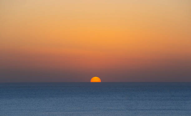 istock Beautiful evening sunset with clouds over the sea 1286990804