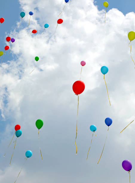 istock colored balloons flying in the sky after party 1286995271