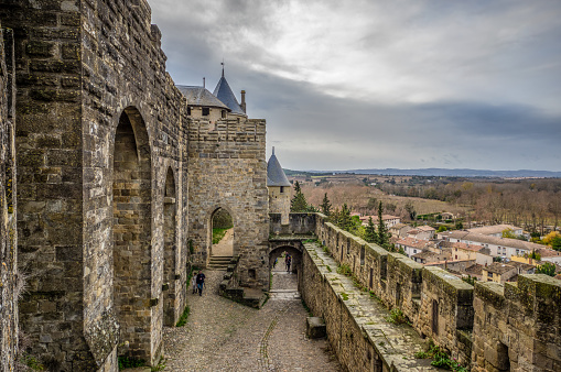 Carcassonne, France - December 08, 2017: Medieval citadel of Carcassonne. Carcassonne is in the Aude department and chief town of the Languedoc-Roussillon region in the south-west France. Its historic center consists of a walled medieval citadel protected by UNESCO since 1997.
