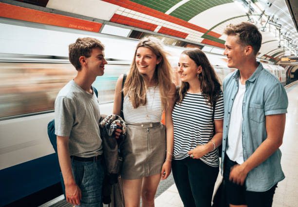 istock friends waiting the train in the subway 1287003692
