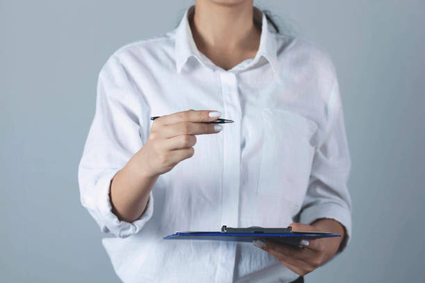 istock woman hand files  in pen 1287004839
