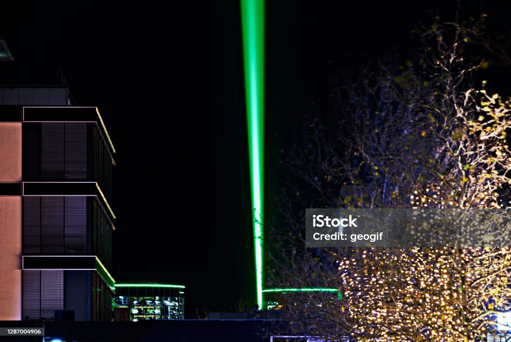 Laser beam over 1.5 km through the city center, sign of optimism in Corona Lockdown, which can be seen in the pedestrian zone Abstract Stock Photo