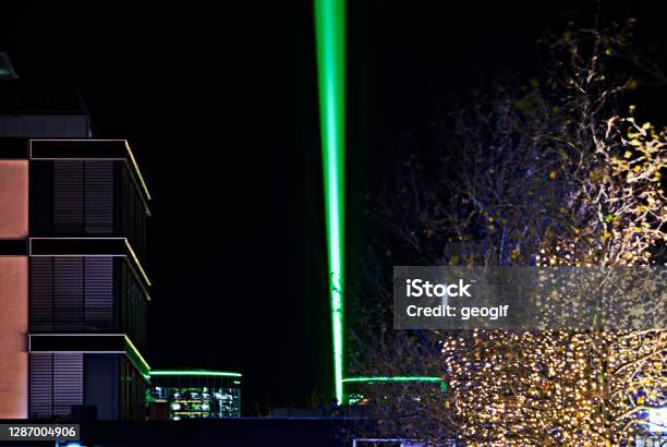 Laser Beam Over 15 Km Through The City Center Sign Of Optimism In Corona Lockdown Which Can Be Seen In The Pedestrian Zone Stock Photo - Download Image Now