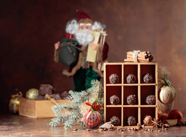 istock Chocolate candies and Christmas decorations. 1287005052