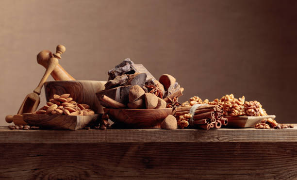 istock Various chocolates with ingredients on an old wooden table. 1287005079