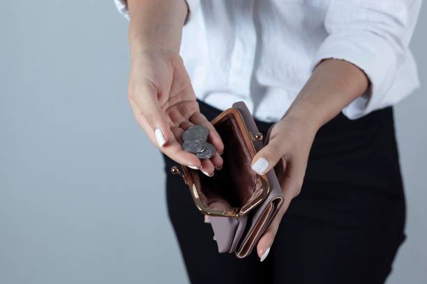 istock woman hand coin with wallet 1287005349