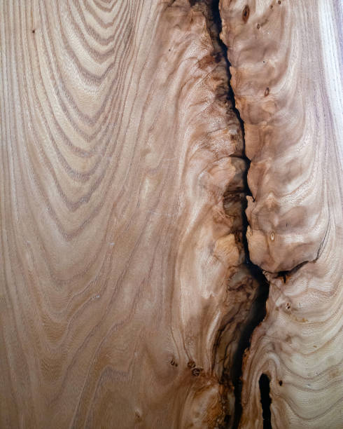 istock Artificial polished wooden surface with a big crack 1287007034
