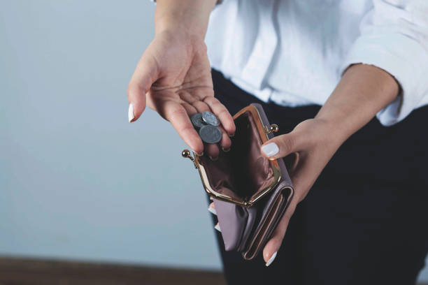 istock woman hand coin with wallet 1287009280
