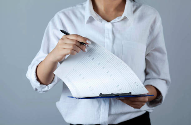 istock woman hand files 1287009759
