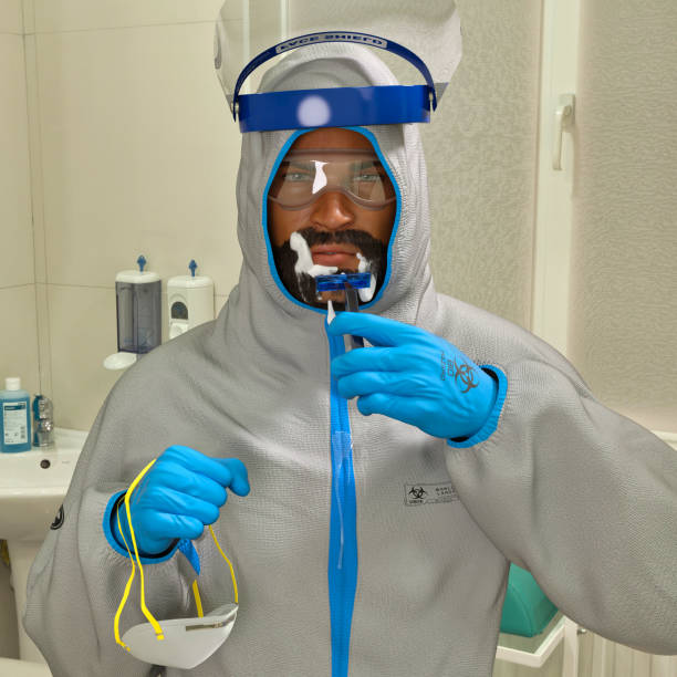 3D Photo of a Male Healthcare Worker Shaving his Beard to Put on His PPE Gear stock photo