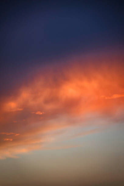 A purple golden night sky with clouds in Milan