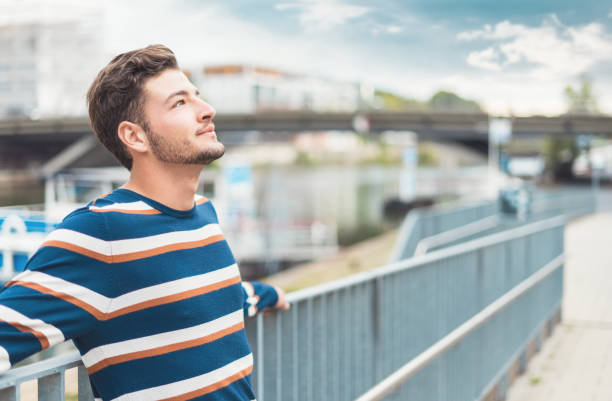 istock Happiness. Joy young beautiful man relaxing at nice day 1287014266