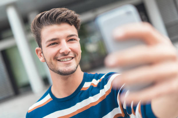 istock Handsome young man taking a picture of himself 1287014303