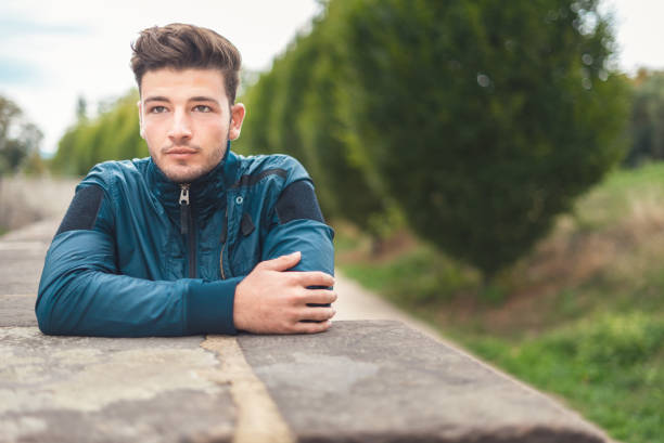 istock Front portrait of young man with copy space - selective focus 1287015021