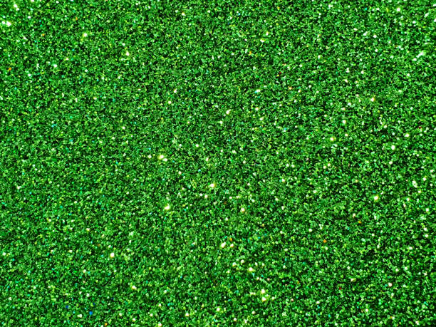 istock Full frame shot of green glitter background 1287015060