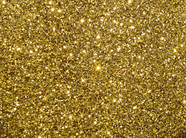 istock Full frame shot of shiny golden glitter background 1287015075
