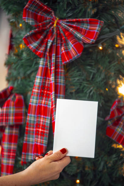 istock woman hand holding empty white card 1287017412