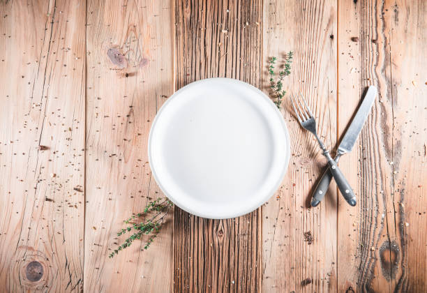 istock Blank clean plate with on table. Ready to serve fresh meal 1287017574