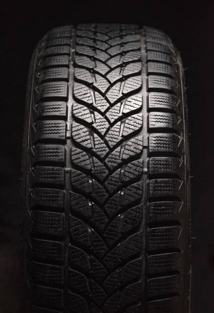 istock Winter tires isolated on black background 1287017657