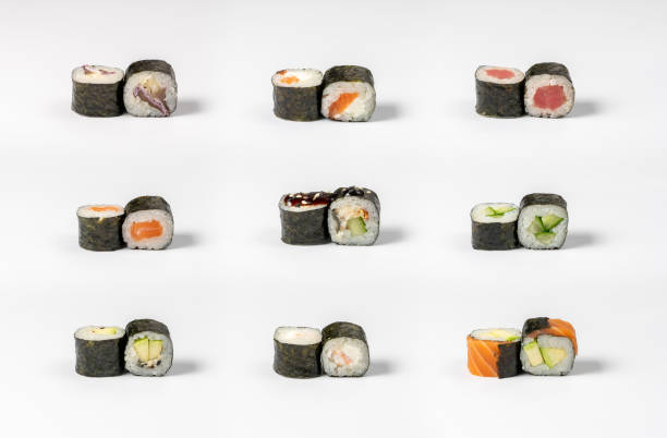 istock Large set of different types of maki sushi on a neutral light background 1287018490