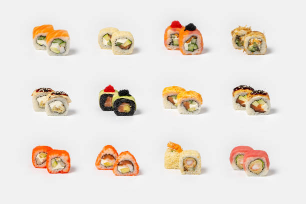 istock Large set of different types of maki sushi on a neutral light background 1287018659