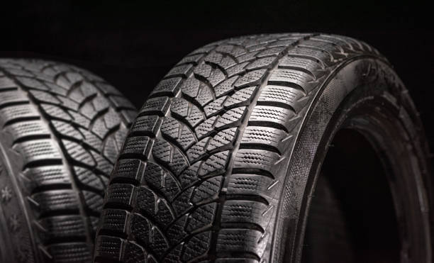 istock Winter tires isolated on black background 1287019104