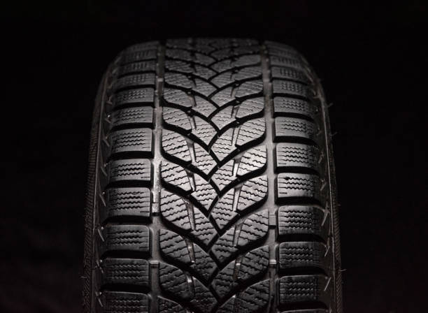 istock Winter tires isolated on black background 1287019105