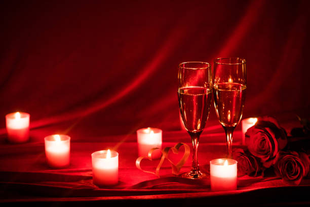 istock Champagne glasses and candles 1287020145