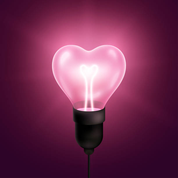 Pink heart light bulb Pink light bulb heart shaped with wire and filament. Vector illustration. Happy Valentines day technology poster with realistic glowing lamp. electric plug dark stock illustrations