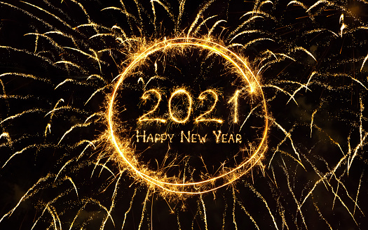 Happy New Year 2021. Golden sparkling text Happy New Year 2021 on black background of firework. Beautiful holiday greeting card, billboard and Web banner.