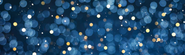 Wide Angle blue celebration Bokeh background Wide Angle blue celebration Bokeh background. Beautiful abstract defocused Holiday Texture with glitter light. Backdrop for design. Panoramic header for website, billboard or Web banner anniversary stock pictures, royalty-free photos & images