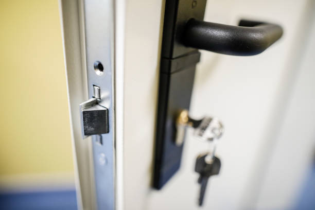 Shallow depth of field (selective focus) image with a metal door lock. Shallow depth of field (selective focus) image with a metal door lock. door chain stock pictures, royalty-free photos & images