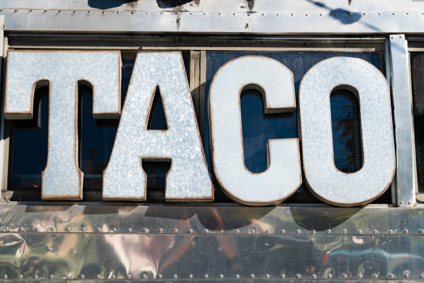 Metal Sign that reads Taco on a Mexican Taco Food Truck in Austin Texas