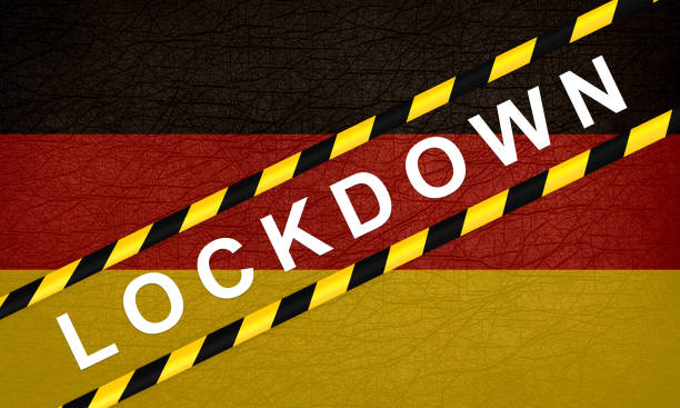 istock GERMANY LOCKDOWN. Stay home! Home Quarantine. Background, banner, poster with text inscription over GERMANY flag. Covid-19. 1287025163