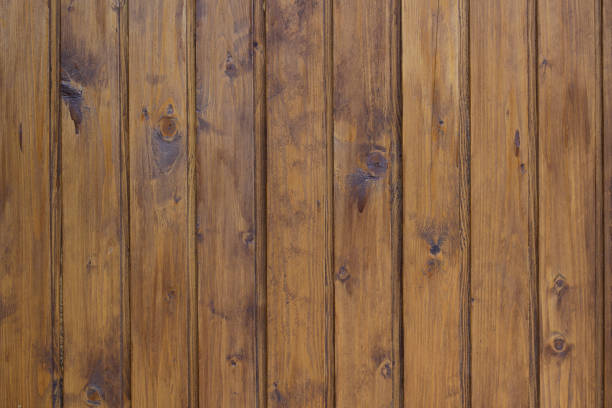 istock Stained brown wooden wall background. 1287025554
