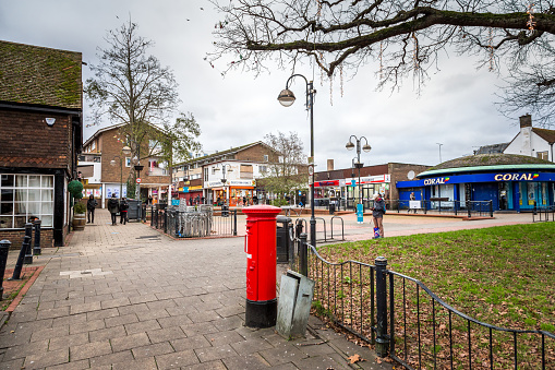 Crawley, UK - 21 November, 2020: the town centre of Crawley, West Sussex, UK, in the middle of lockdown during the covid pandemic at the end of 2020. The town centre is very quiet, with most shops shut, and people wearing face masks and social distancing.