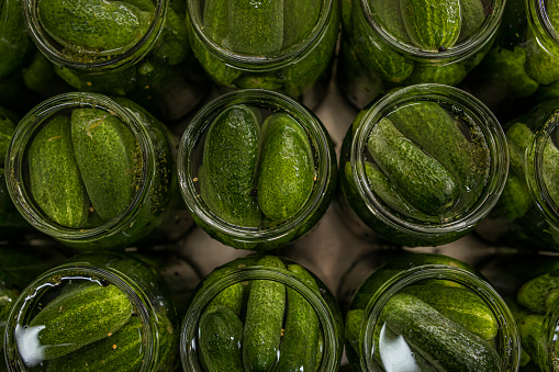Photo of healthy organic pickled cucumbers in a jar